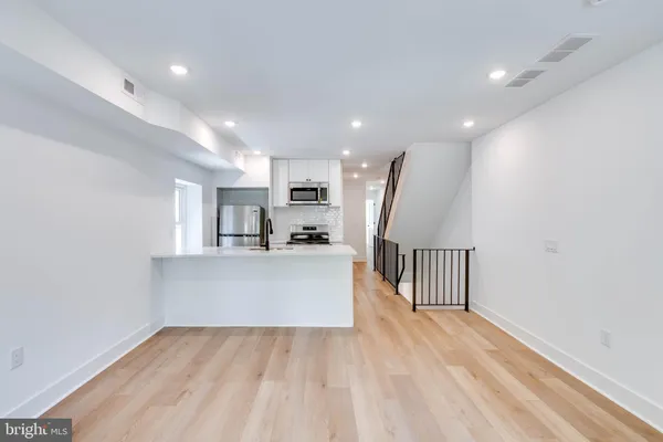 a view of kitchen and wooden floor
