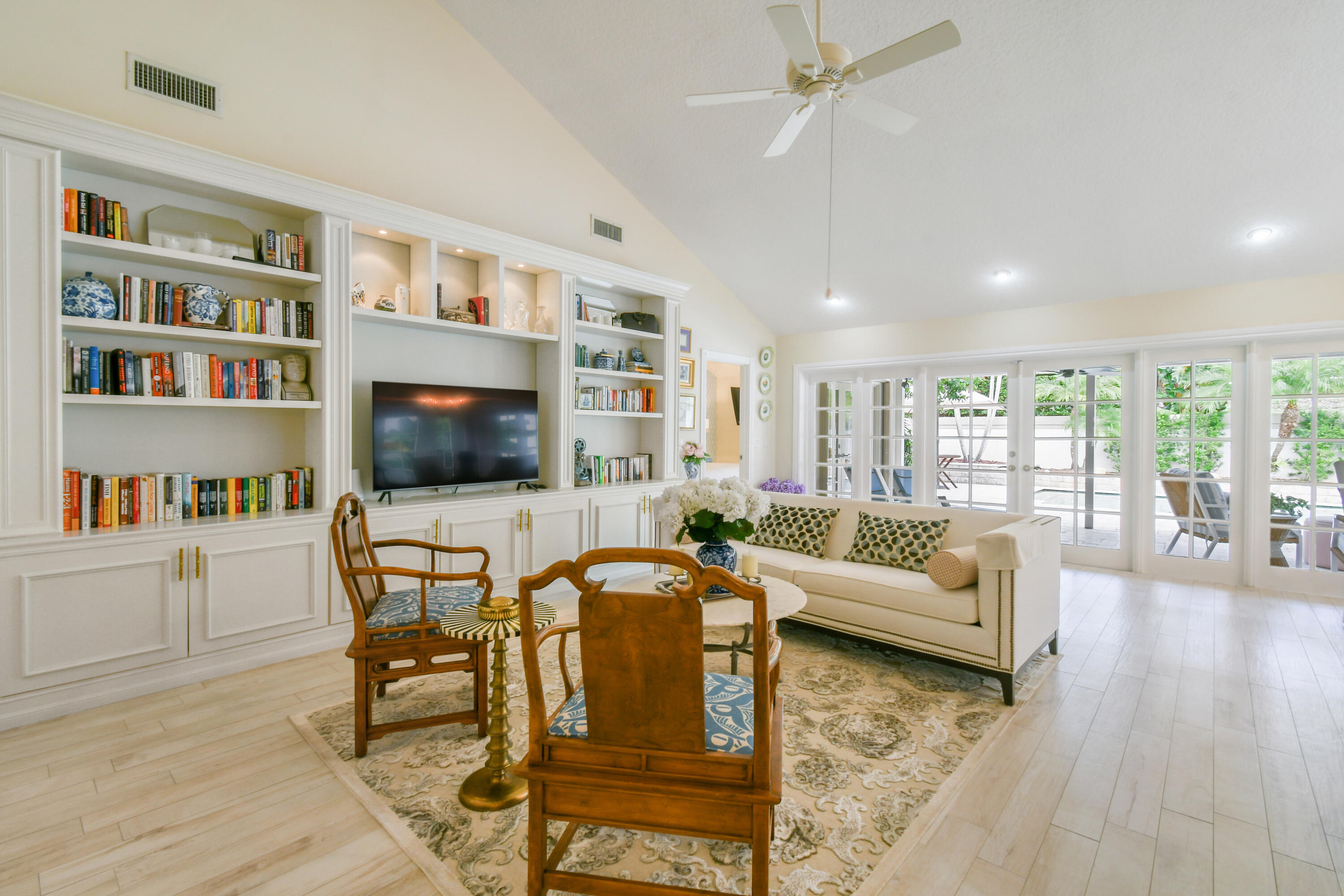 127 Dunes Edge Road Jupiter, FL 33477 - Photo 17 of 58 a living room with furniture and a flat screen tv