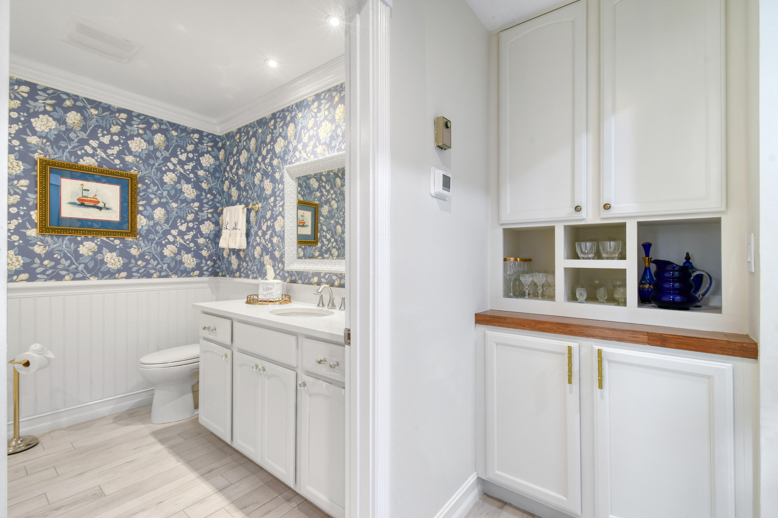 127 Dunes Edge Road Jupiter, FL 33477 - Photo 46 of 58 a view of a bathroom with two sinks and a window