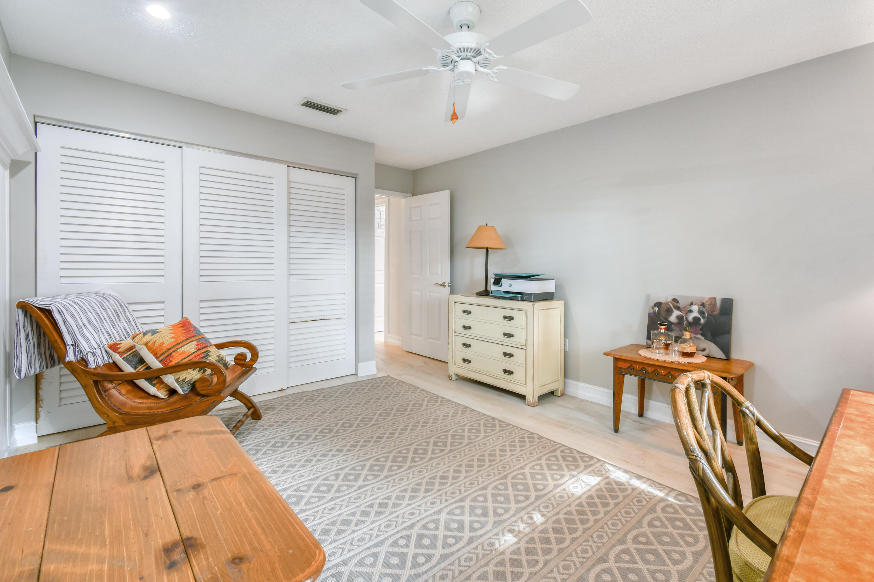127 Dunes Edge Road Jupiter, FL 33477 - Photo 50 of 58 a bedroom with furniture and a bed