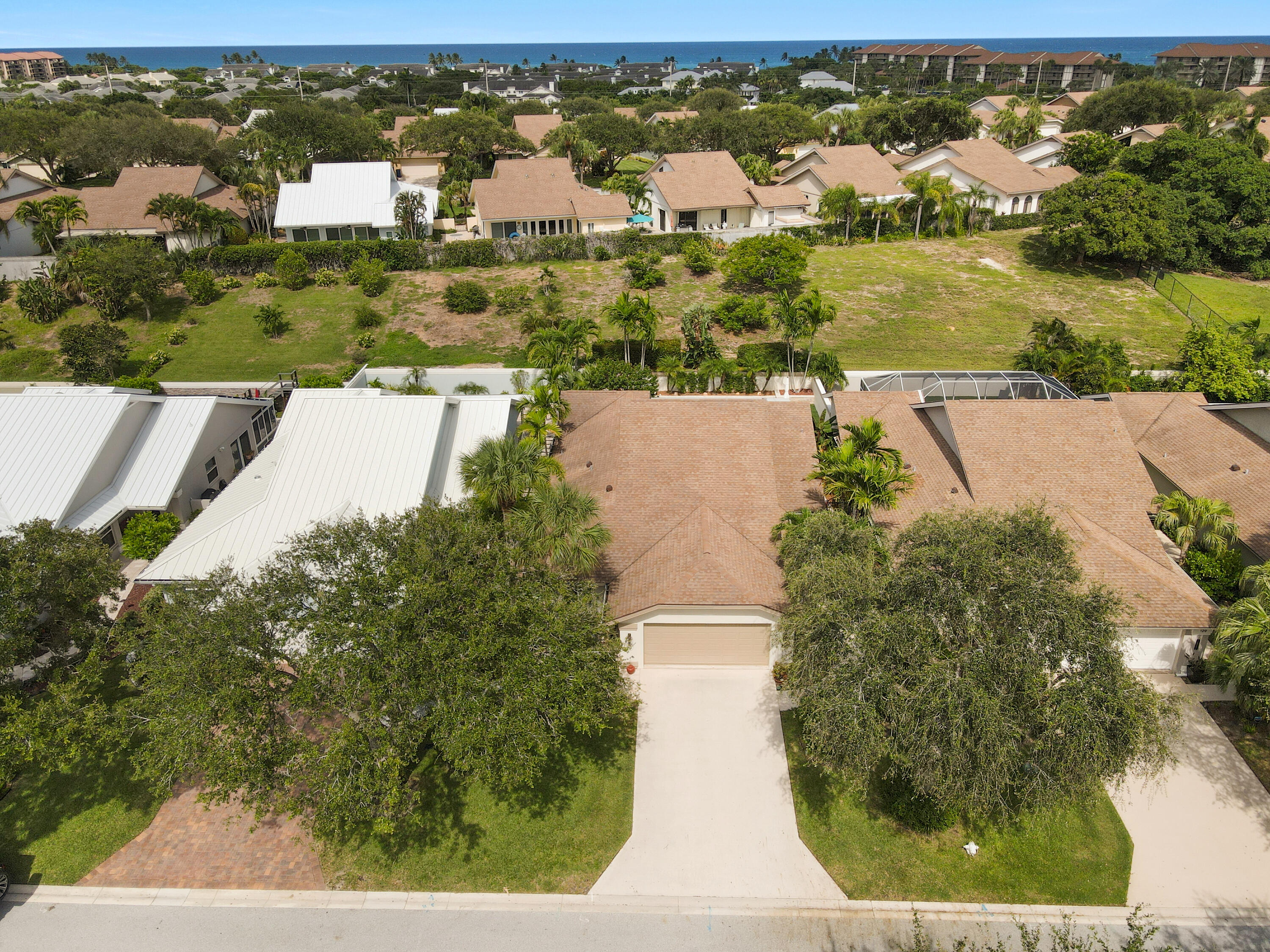 127 Dunes Edge Road Jupiter, FL 33477 - Photo 5 of 58 an aerial view of residential houses with outdoor space