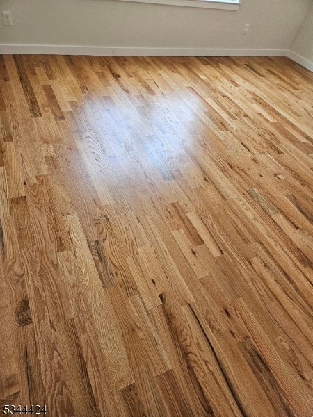 685 Bergen Street Newark, NJ 07108 - Photo 6 of 12 a view of room with wooden floor