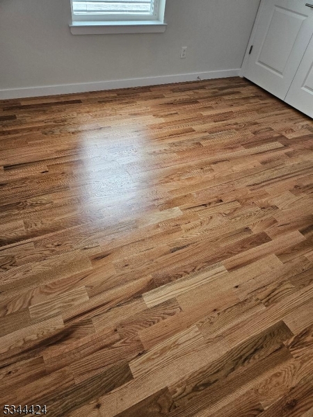 685 Bergen Street Newark, NJ 07108 - Photo 8 of 12 a view of empty room with wooden floor
