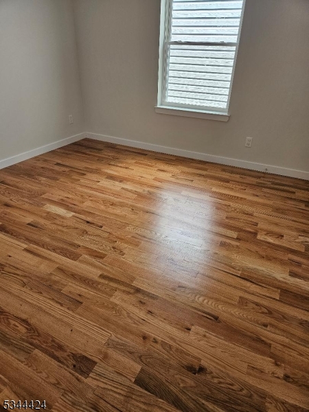 685 Bergen Street Newark, NJ 07108 - Photo 9 of 12 a view of empty room with wooden floor