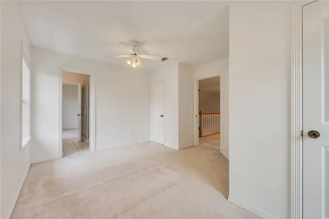 a spacious bathroom with a shower and a sink