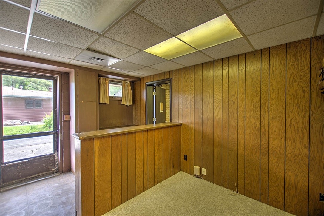 4480 Fort Daniel Road Decatur, IL 62521 - Photo 20 of 34 a view of a hallway with wooden walls