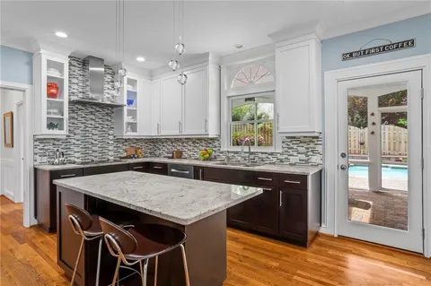a kitchen with a table and chairs in it