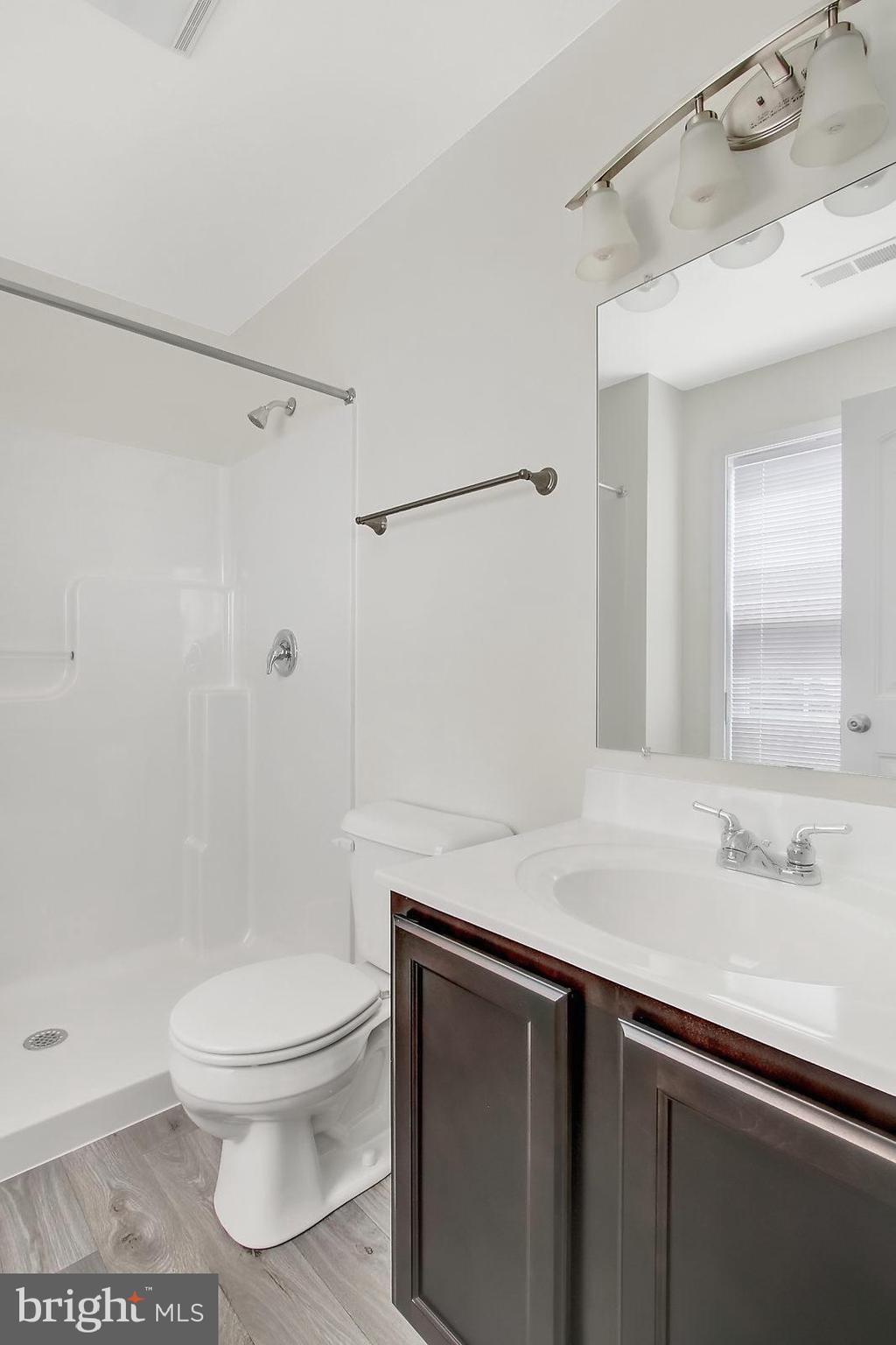 127 Balsam Lane Hanover, PA 17331 - Photo 8 of 11 a bathroom with a sink a toilet and shower