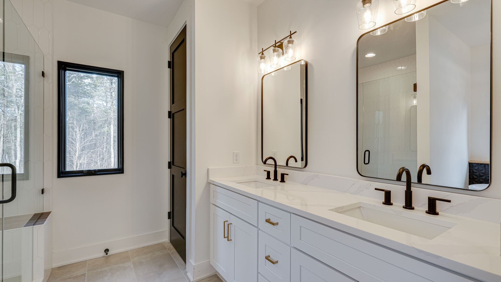 8564 Taliaferro Road Eagleville, TN 37060 - Photo 17 of 49 a bathroom with double vanity sinks and a mirror