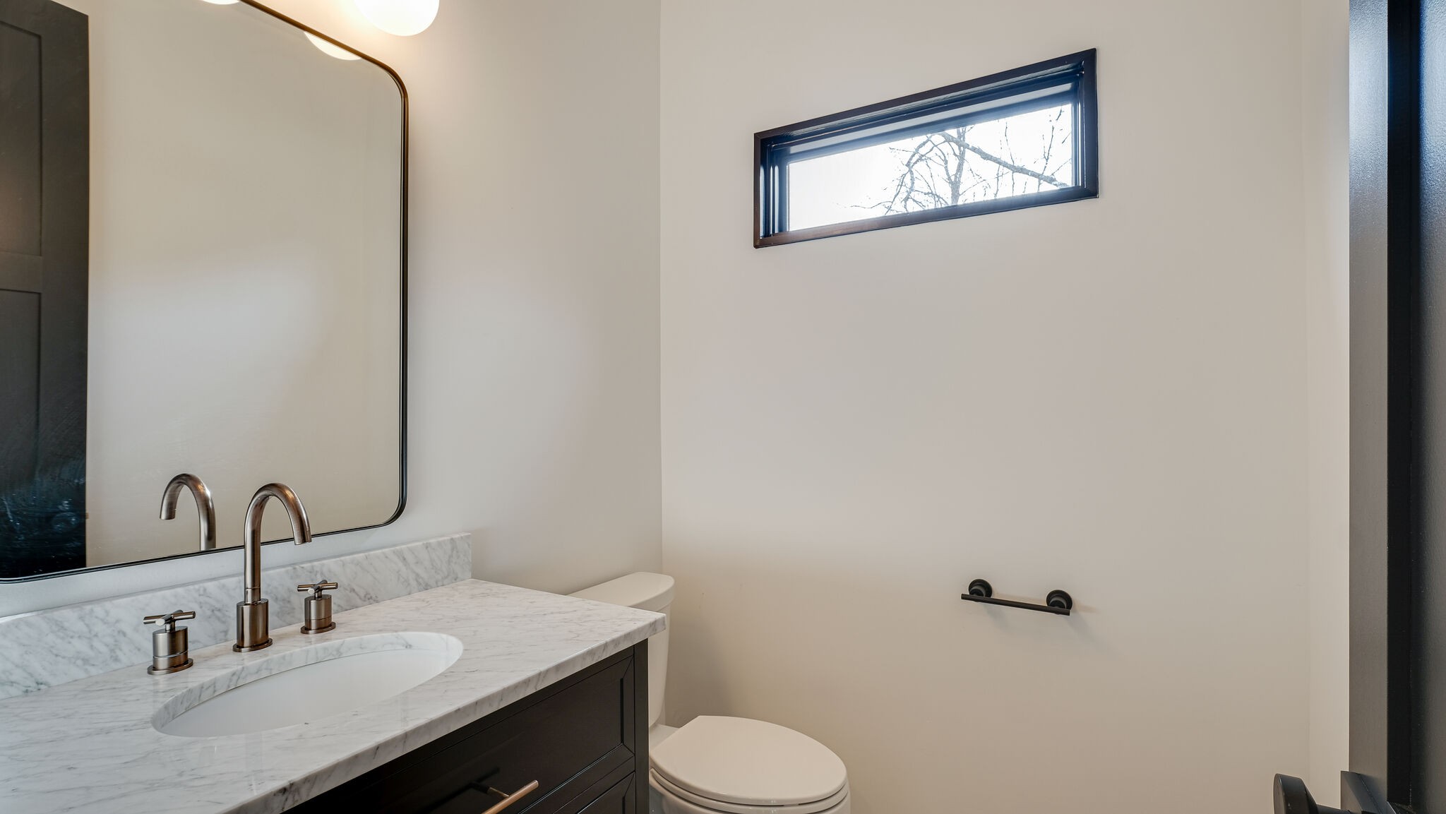 8564 Taliaferro Road Eagleville, TN 37060 - Photo 36 of 49 a bathroom with a sink and a mirror