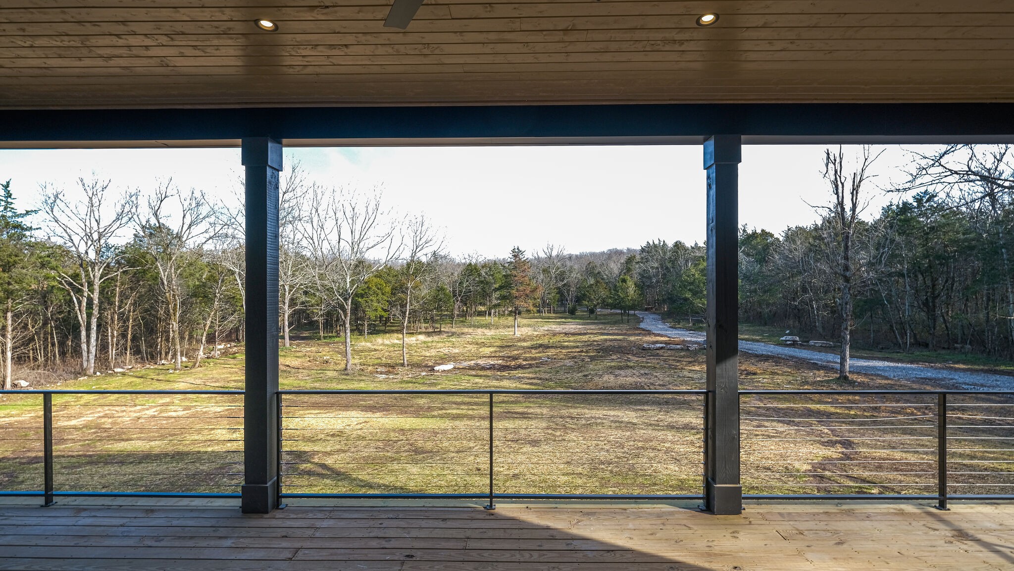 8564 Taliaferro Road Eagleville, TN 37060 - Photo 40 of 49 a view of a balcony with a floor to ceiling window next to a yard