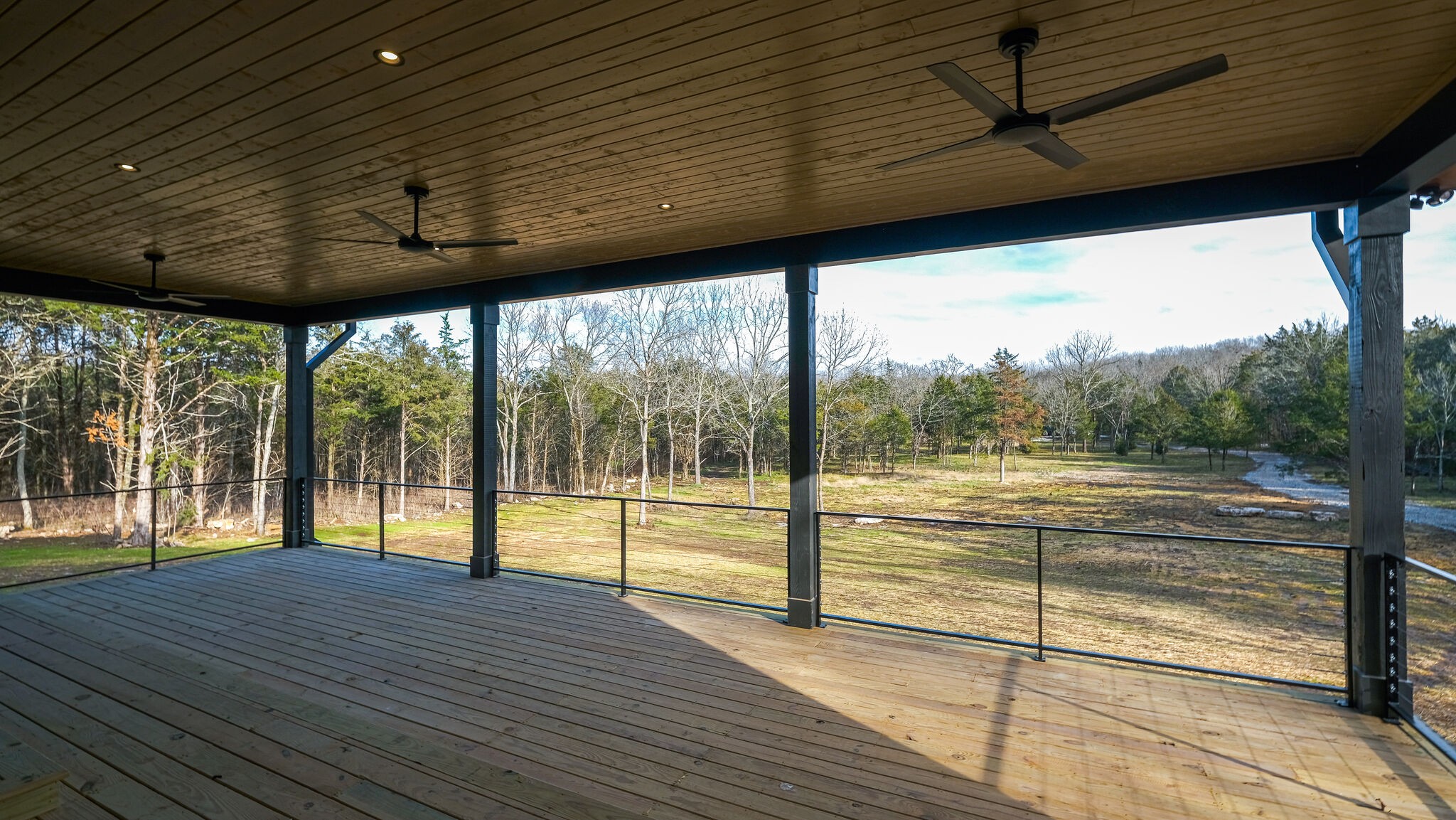 8564 Taliaferro Road Eagleville, TN 37060 - Photo 41 of 49 a view of empty room with wooden floor and fan
