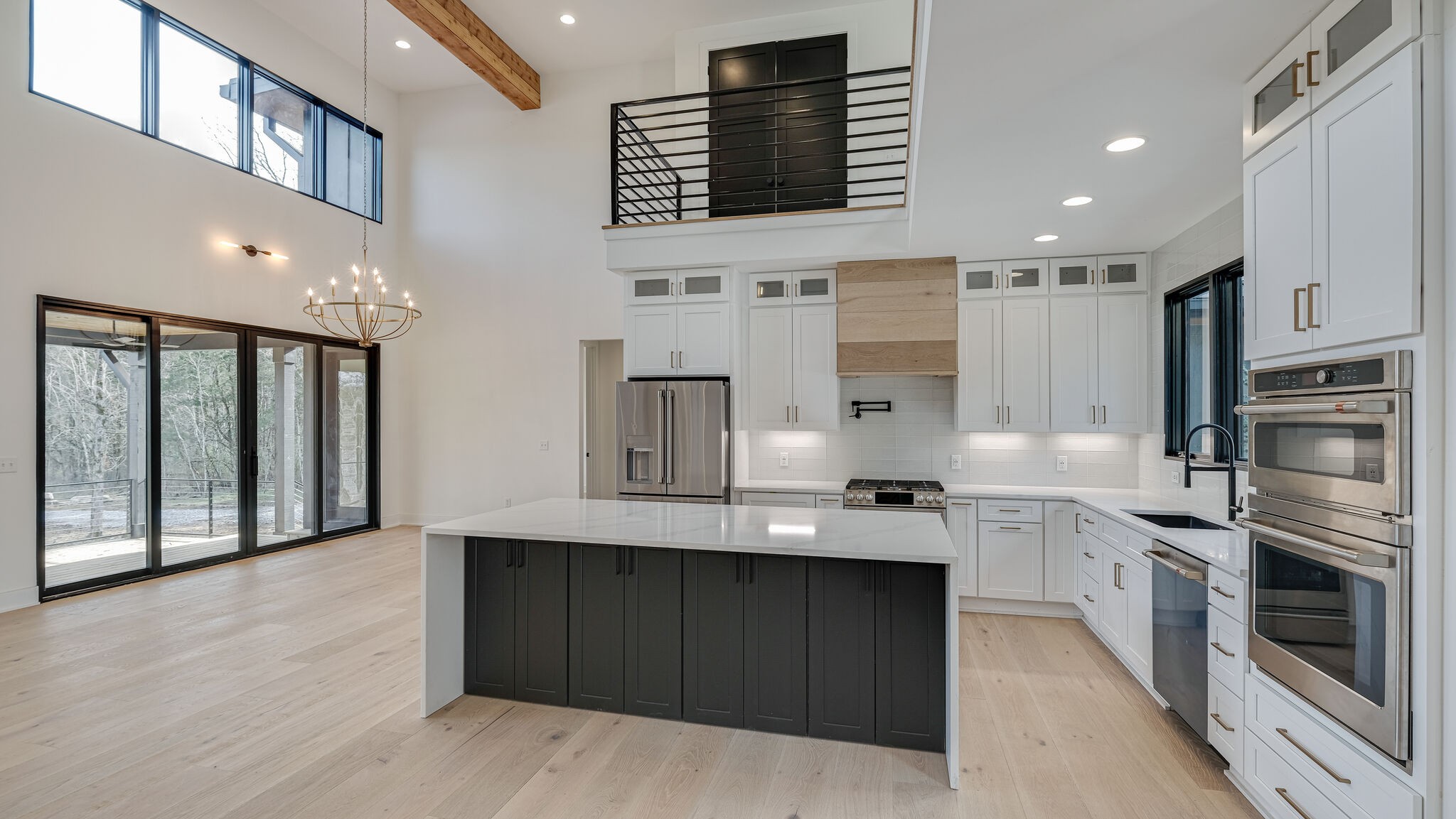 8564 Taliaferro Road Eagleville, TN 37060 - Photo 6 of 49 a large kitchen with stainless steel appliances kitchen island granite countertop a stove and a sink