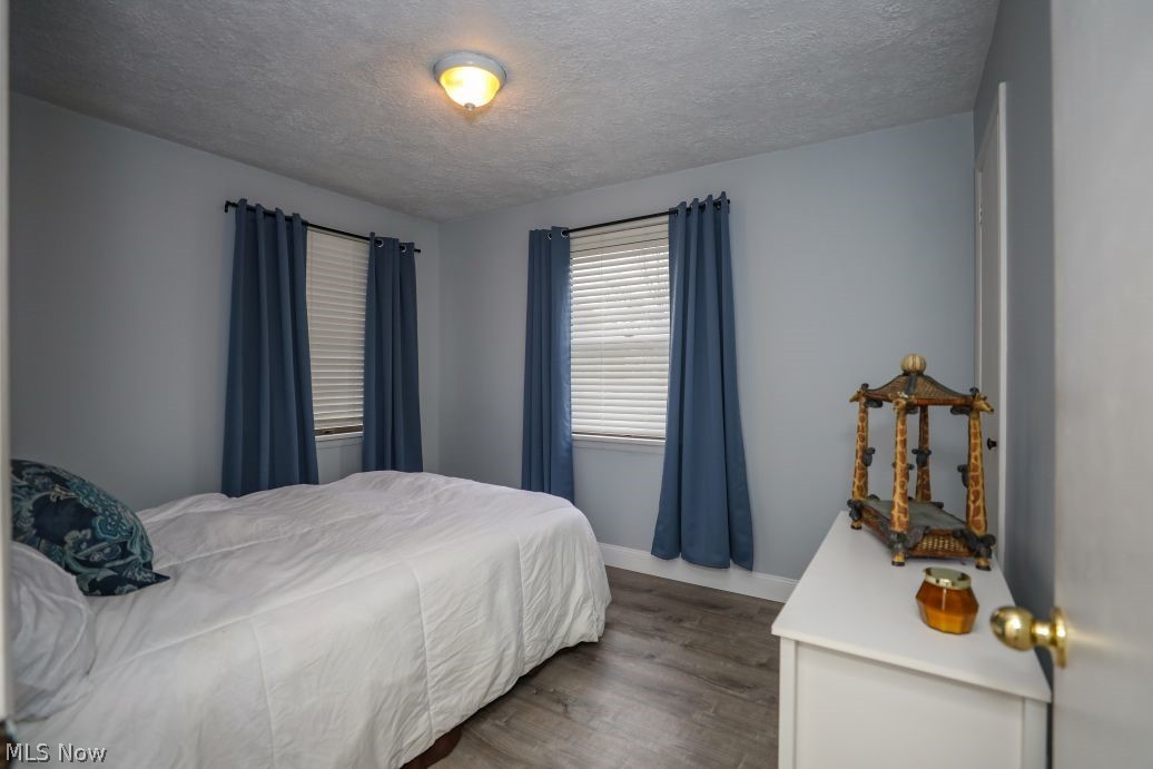 10676 Holcomb Road Newton Falls, OH 44444 - Photo 21 of 38 Bedroom featuring LVT flooring and a textured ceiling