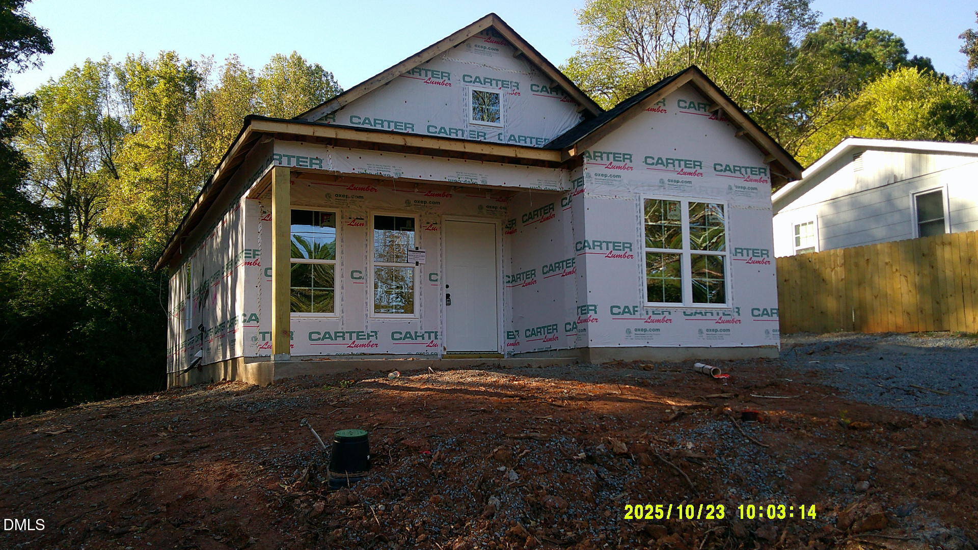 145 East Jay Street Coats, NC 27521 - Photo 2 of 15 a view of a brick house with a yard