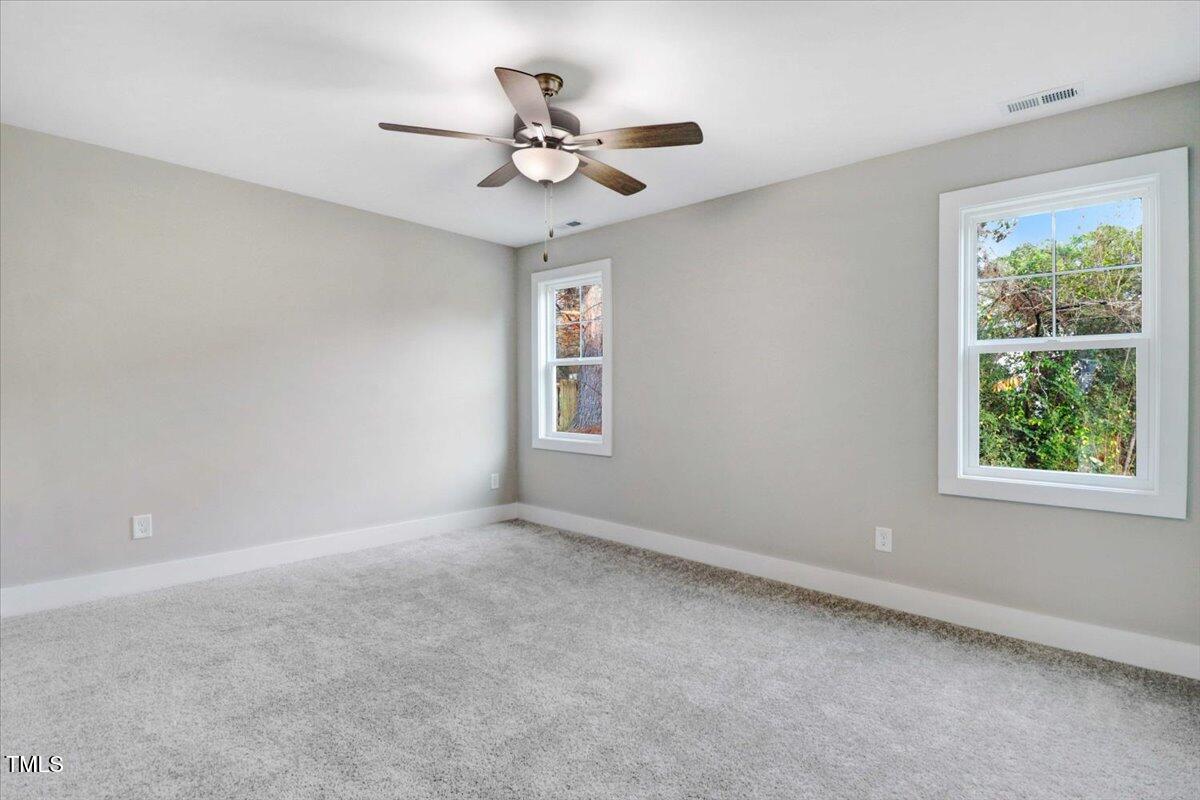 145 East Jay Street Coats, NC 27521 - Photo 8 of 15 a view of an empty room with a window