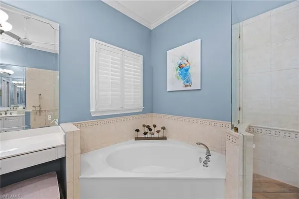 a bathroom with a tub and a sink