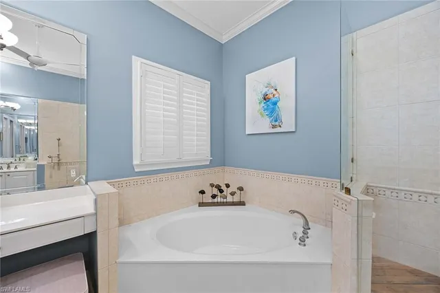 a bathroom with a tub and a sink