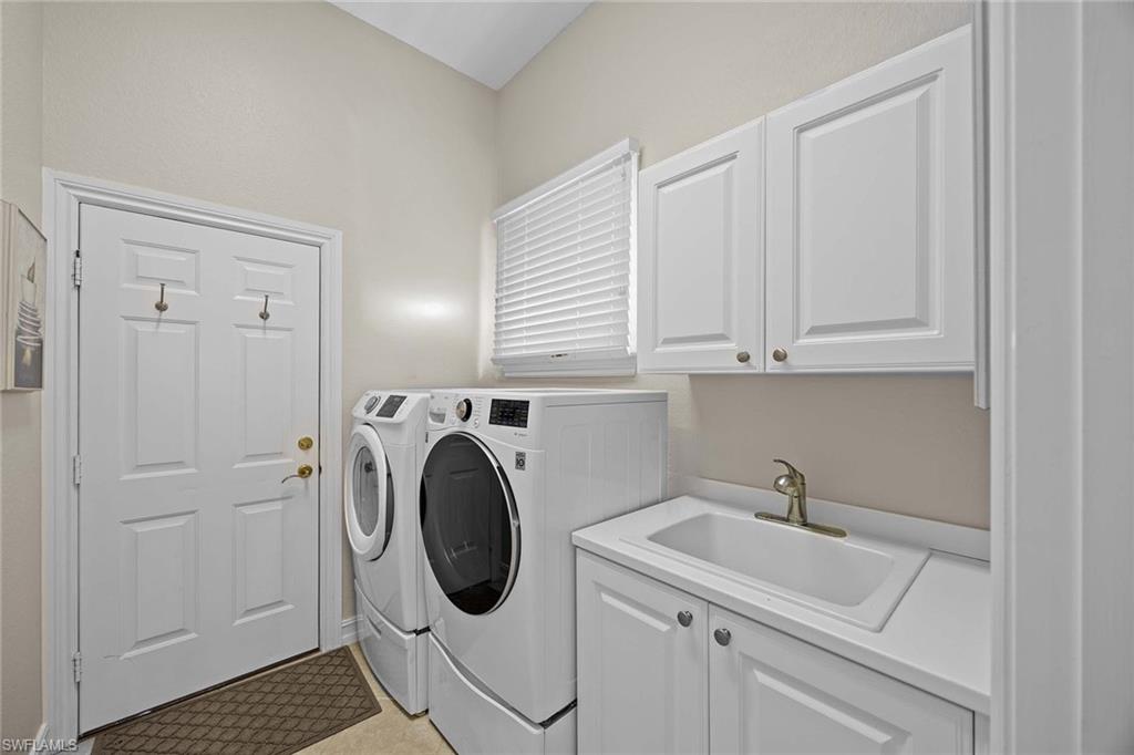 8446 Mallards Way Naples, FL 34114 - Photo 25 of 50 a utility room with sink dryer and washer