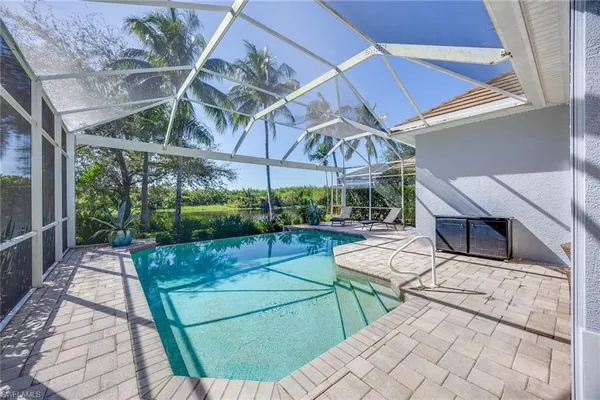 a view of a backyard with sitting area