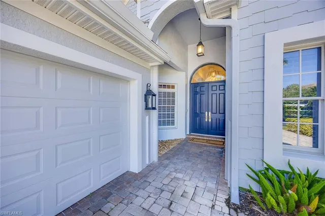 a view of entryway with a front door and wooden floor