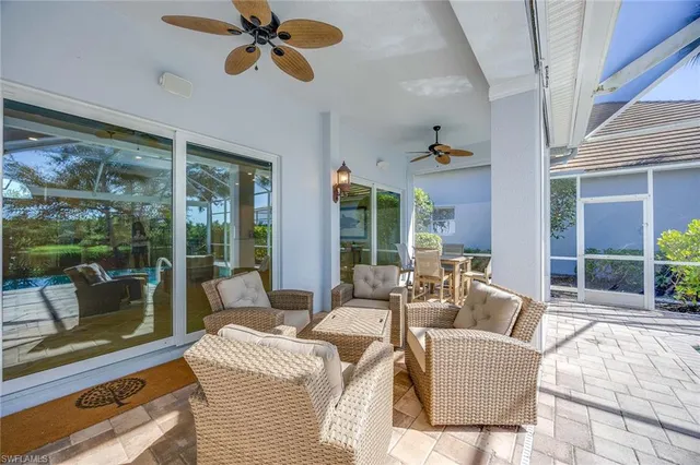 an aerial view of residential houses with outdoor space and swimming pool