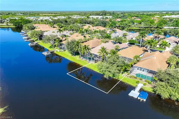 an aerial view of a house with yard swimming pool and outdoor seating