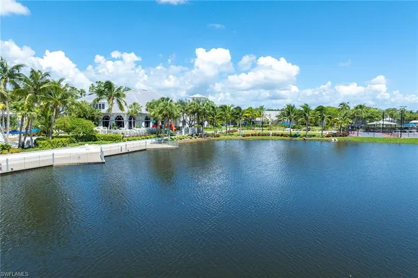 a view of a lake with houses in the back