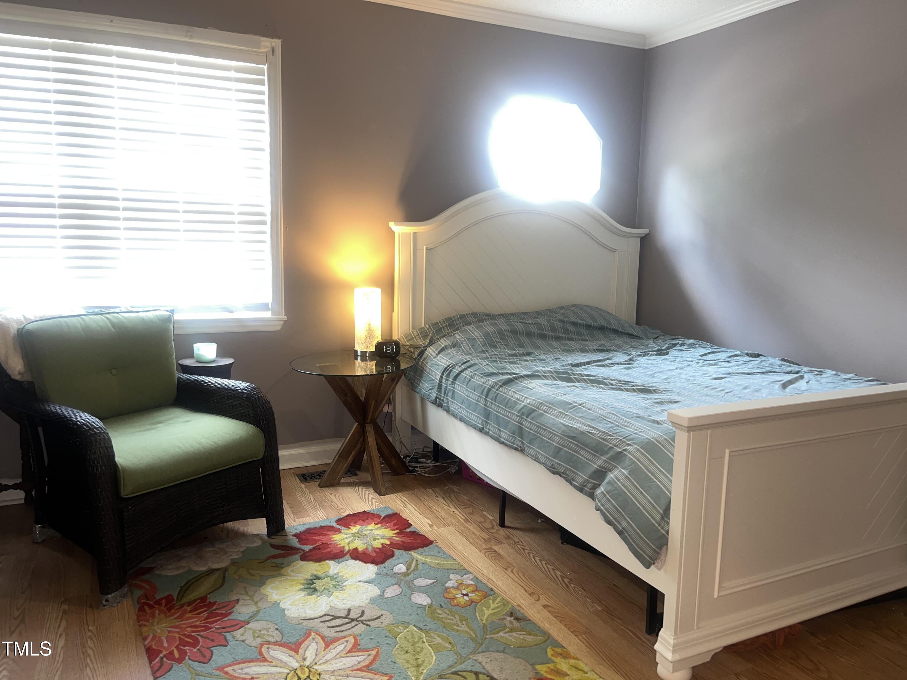 1823 Vintage Road Raleigh, NC 27610 - Photo 11 of 14 a bedroom with a bed window and couch