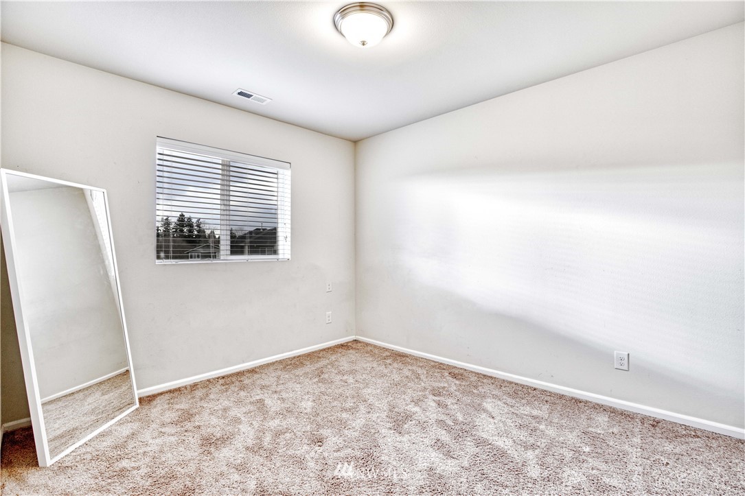 4866 East R Street Tacoma, WA 98404 - Photo 12 of 25 wooden floor in an empty room