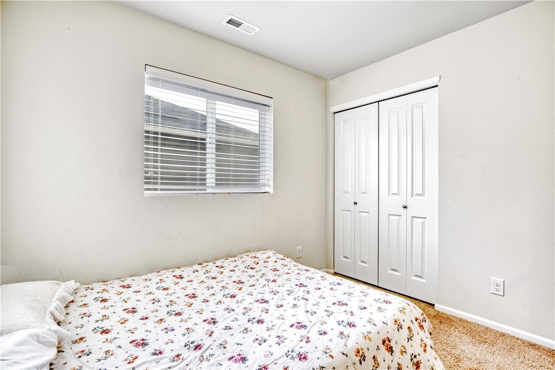 4866 East R Street Tacoma, WA 98404 - Photo 14 of 25 a bedroom with a bed and a window