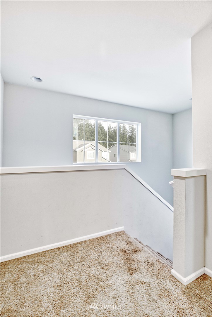 4866 East R Street Tacoma, WA 98404 - Photo 20 of 25 a view of empty room with wooden floor and fan