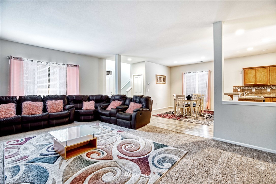 4866 East R Street Tacoma, WA 98404 - Photo 6 of 25 a living room with furniture and a table
