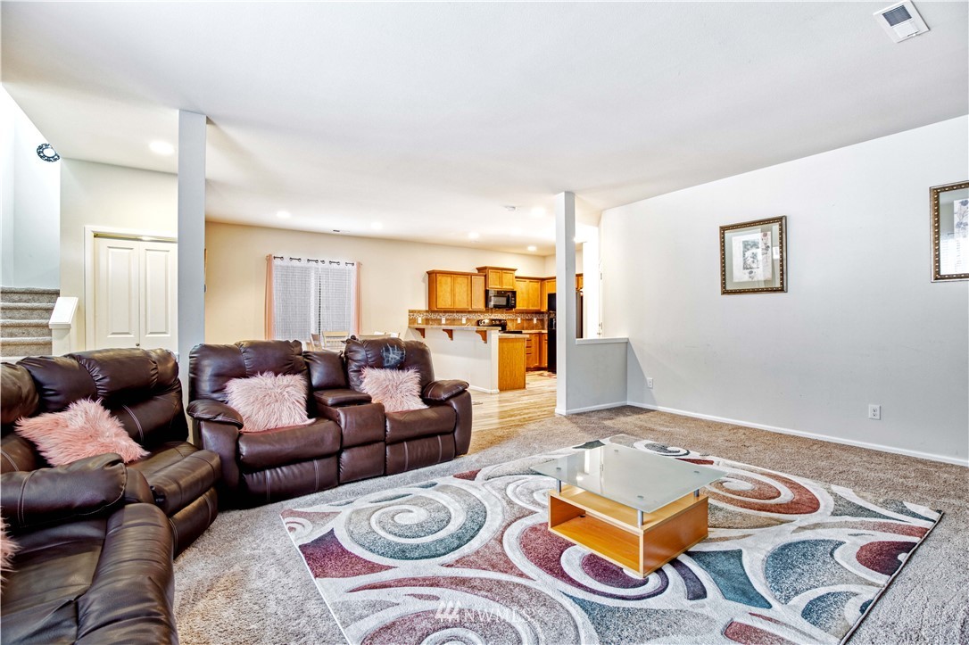 4866 East R Street Tacoma, WA 98404 - Photo 7 of 25 a living room with furniture and wooden floor