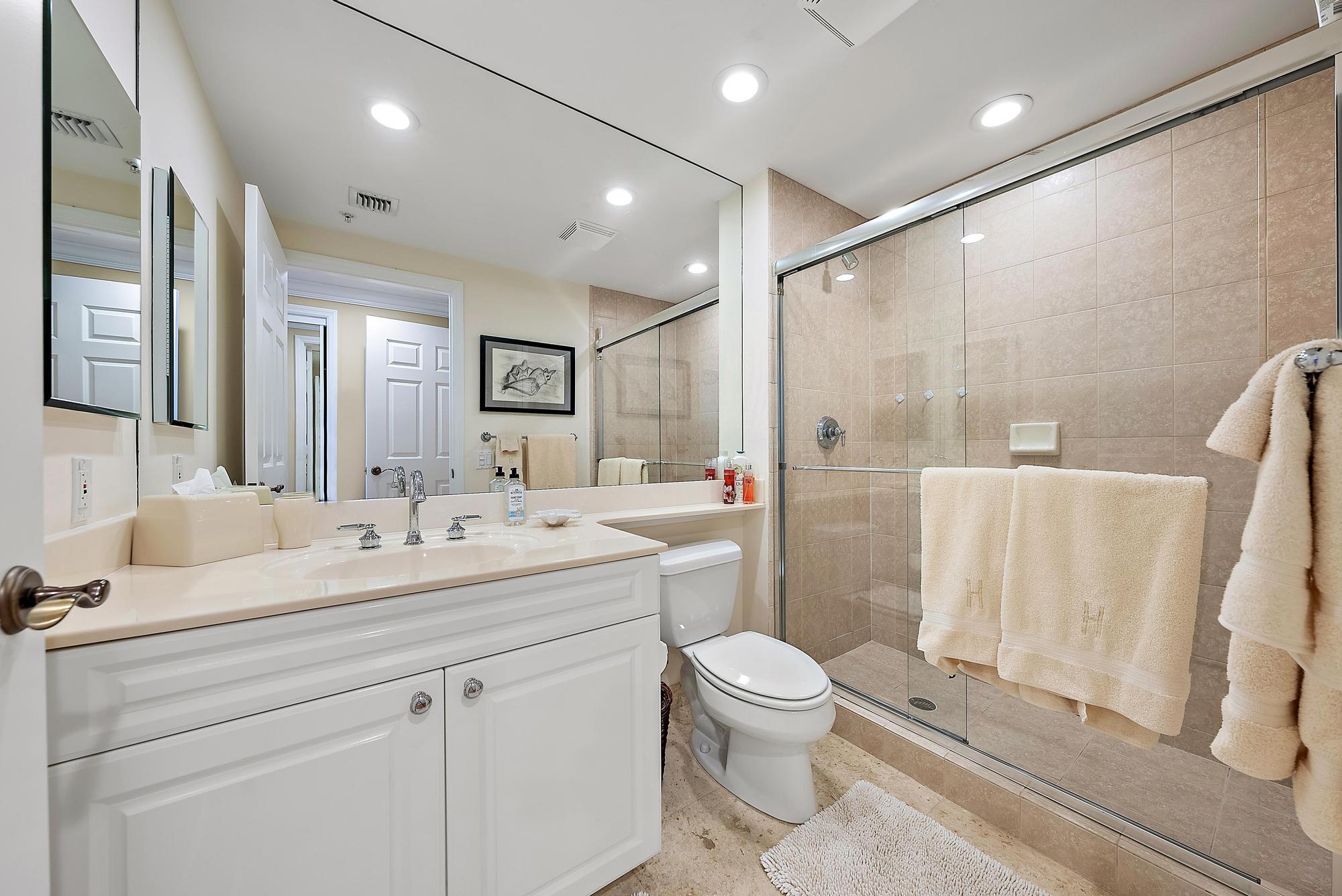 340 Highway 1, Unit 305 Jupiter, FL 33477 - Photo 17 of 26 a bathroom with a sink a toilet and shower