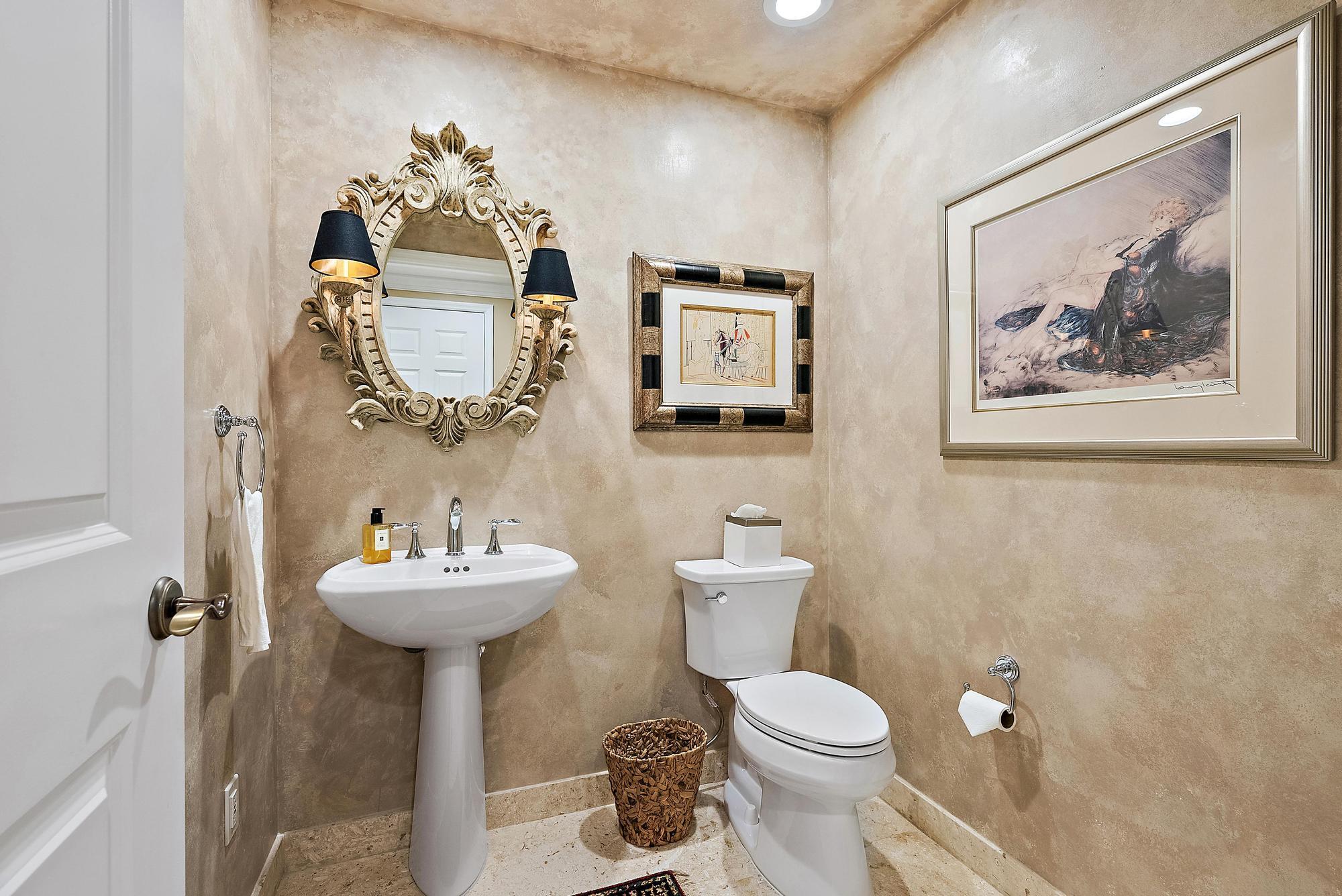340 Highway 1, Unit 305 Jupiter, FL 33477 - Photo 20 of 26 a bathroom with a toilet sink and mirror