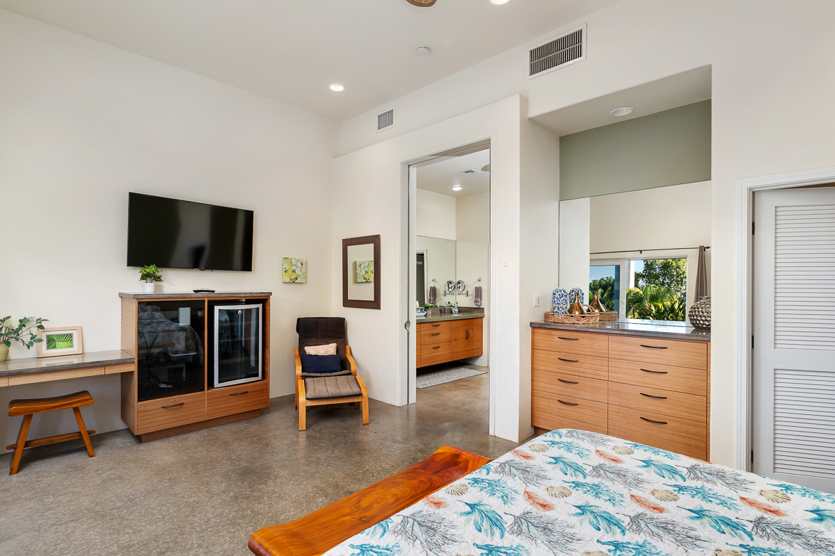 34-144 Kaihuiki Road Ninole, HI 96773 - Photo 16 of 25 a living room with furniture and a flat screen tv