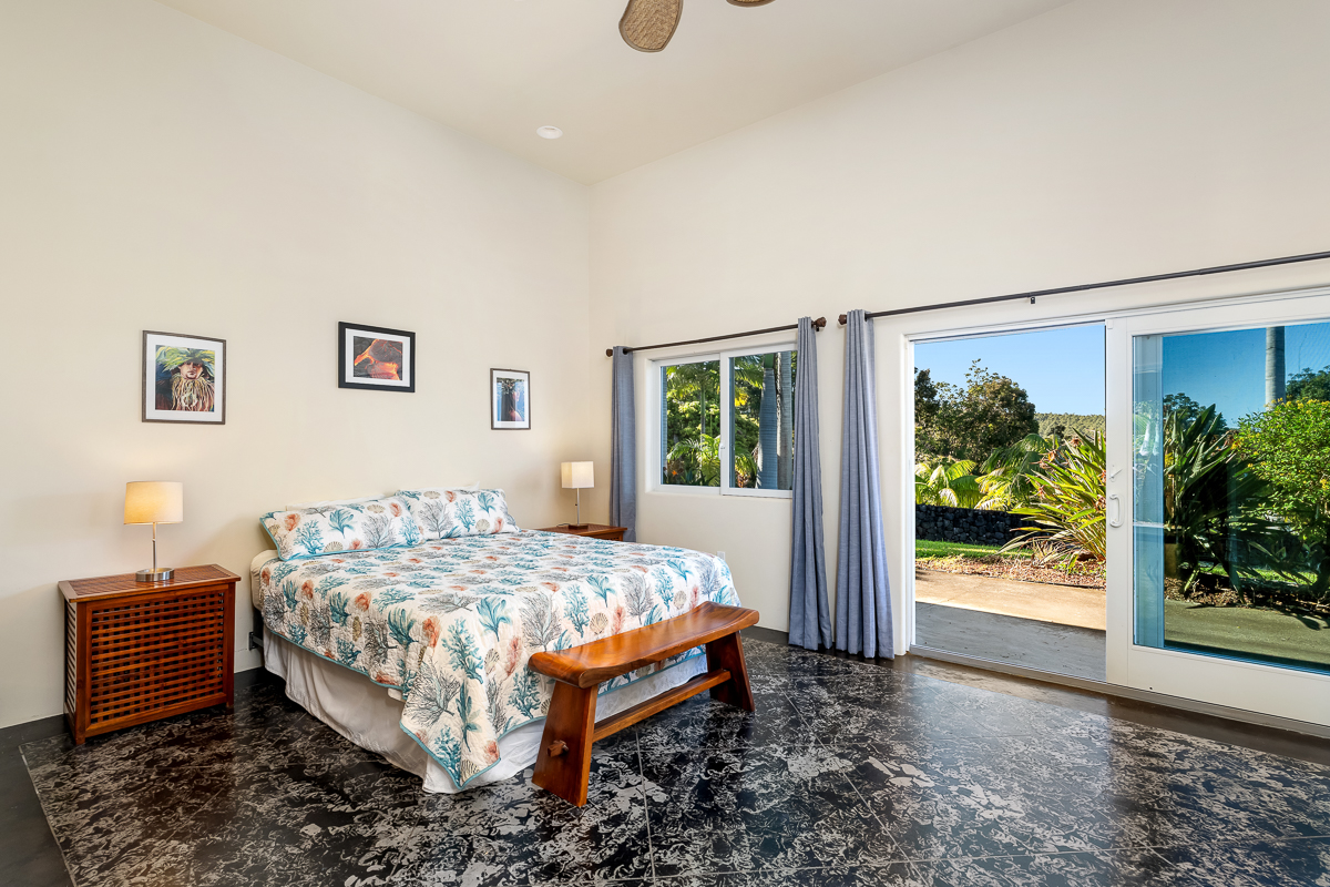34-144 Kaihuiki Road Ninole, HI 96773 - Photo 18 of 25 a bedroom with a bed and a window