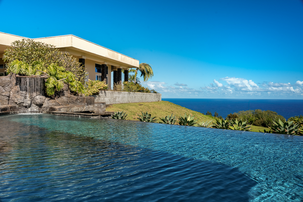 34-144 Kaihuiki Road Ninole, HI 96773 - Photo 19 of 25 a front view of a house with a garden