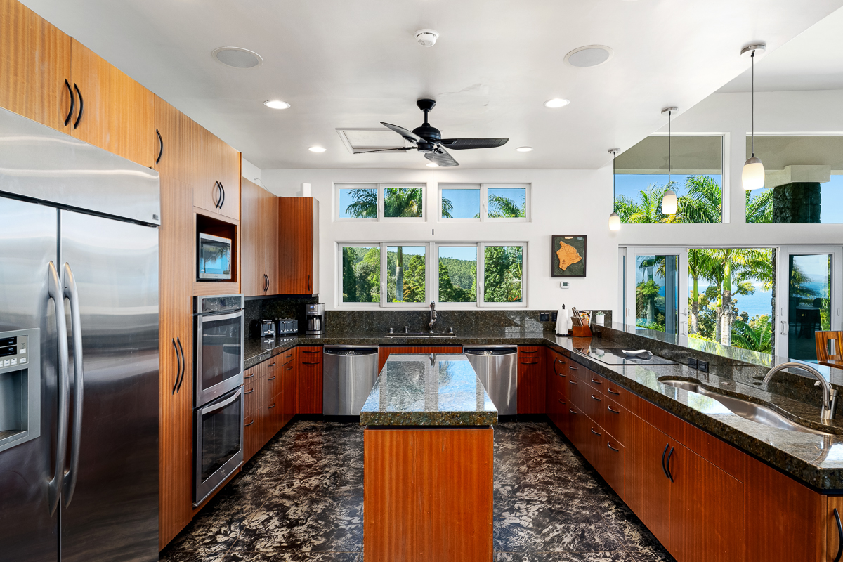 34-144 Kaihuiki Road Ninole, HI 96773 - Photo 8 of 25 a kitchen with stainless steel appliances granite countertop a refrigerator a sink a stove and a refrigerator