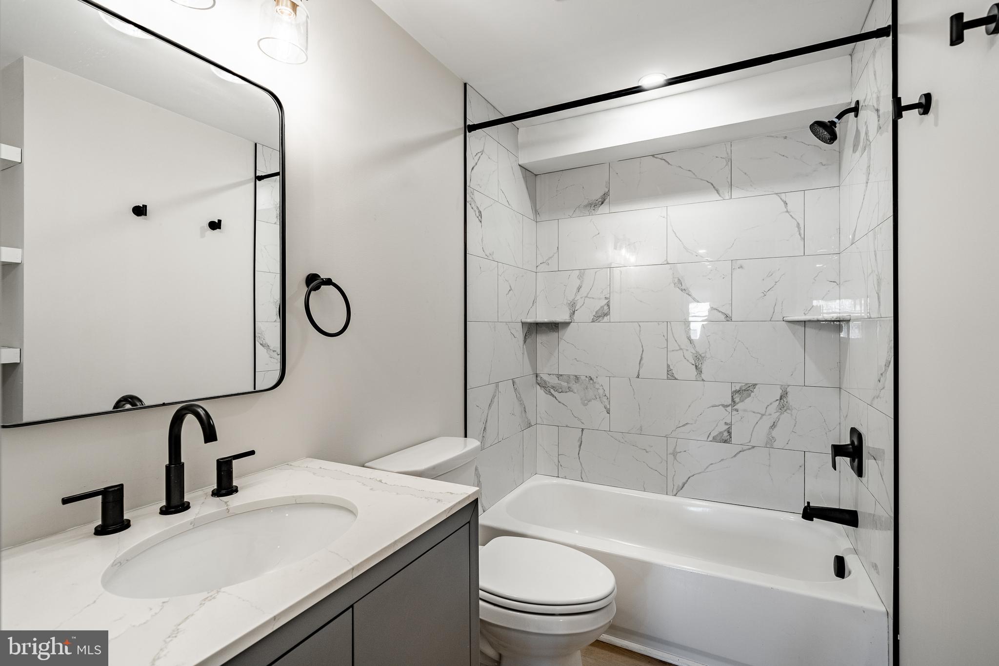530 Washington Avenue, Unit 4 Phoenixville, PA 19460 - Photo 12 of 28 a bathroom with a sink vanity toilet and shower