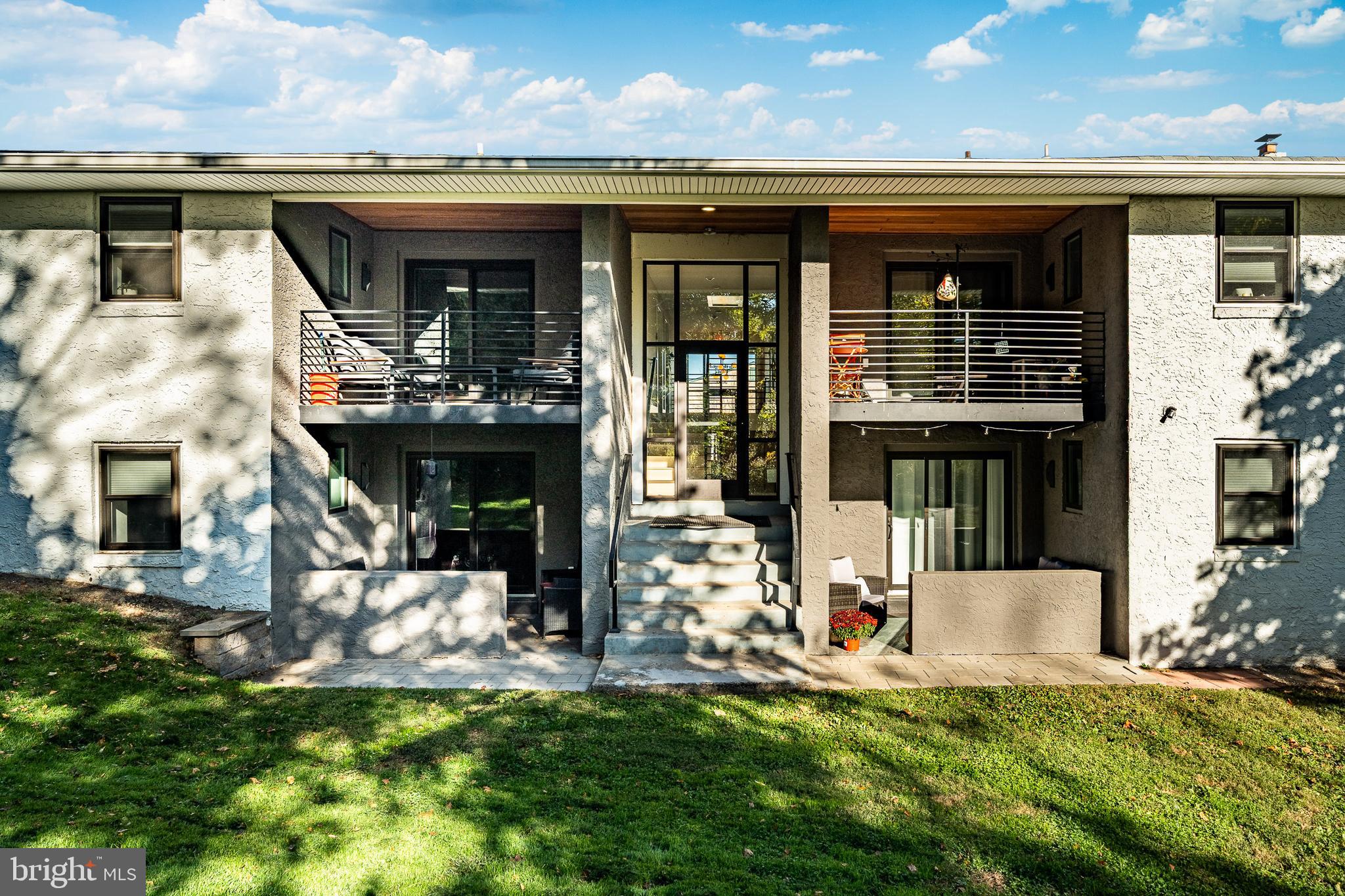 530 Washington Avenue, Unit 4 Phoenixville, PA 19460 - Photo 24 of 28 a view of a house with large windows and a yard
