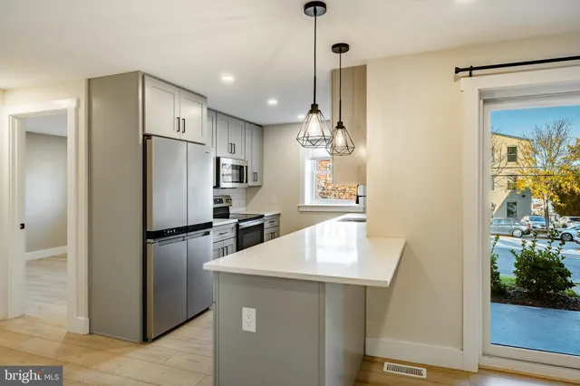 a kitchen with refrigerator and countertop