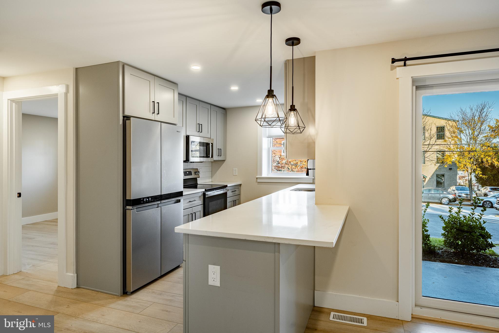 530 Washington Avenue, Unit 4 Phoenixville, PA 19460 - Photo 5 of 28 a kitchen with refrigerator and countertop