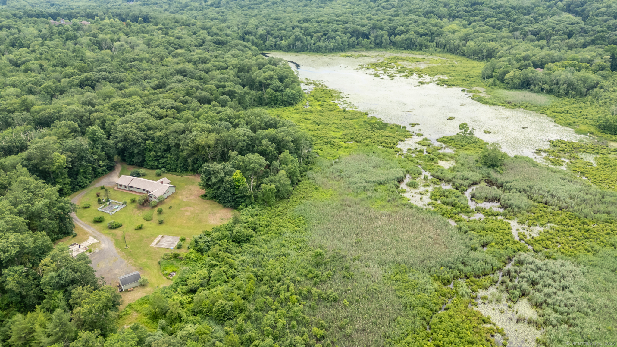 192 Palmer Road Chaplin, CT 06235 - Photo 1 of 1 a view of a lake with a yard