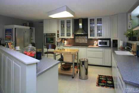 11900 Creedmoor Road Raleigh, NC 27614 - Photo 6 of 10 a kitchen with a sink and cabinets