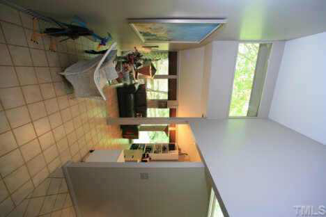 11900 Creedmoor Road Raleigh, NC 27614 - Photo 7 of 10 a bathroom with a sink and a mirror