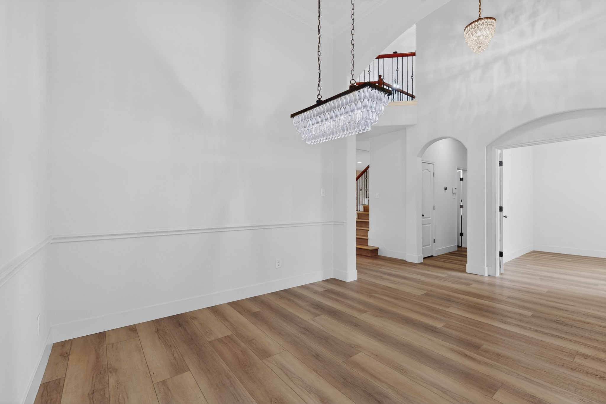 8617 Cobblestone Austin, TX 78735 - Photo 16 of 39 a view of a room with wooden floor ceiling fan and window
