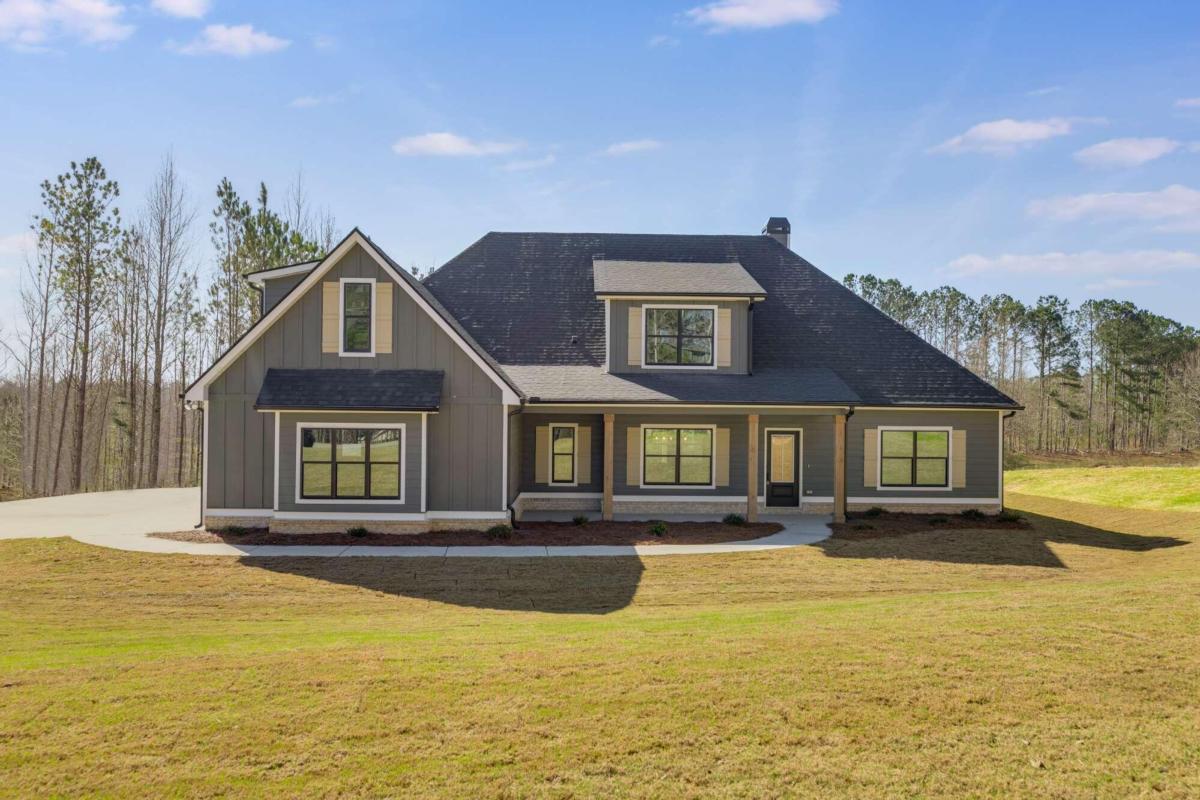 575 Sandhill Hulett Road Villa Rica, GA 30180 - Photo 1 of 1 a front view of houses with yard