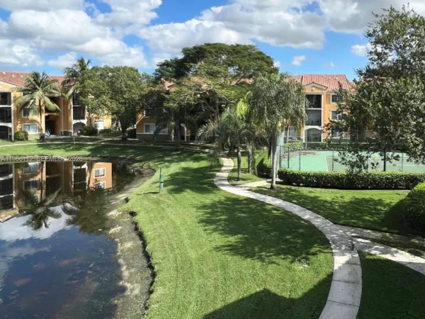 a view of a lake with a house in the background